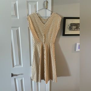 Vintage handmade dresses fits a size 4-6. Small tear near zipper.